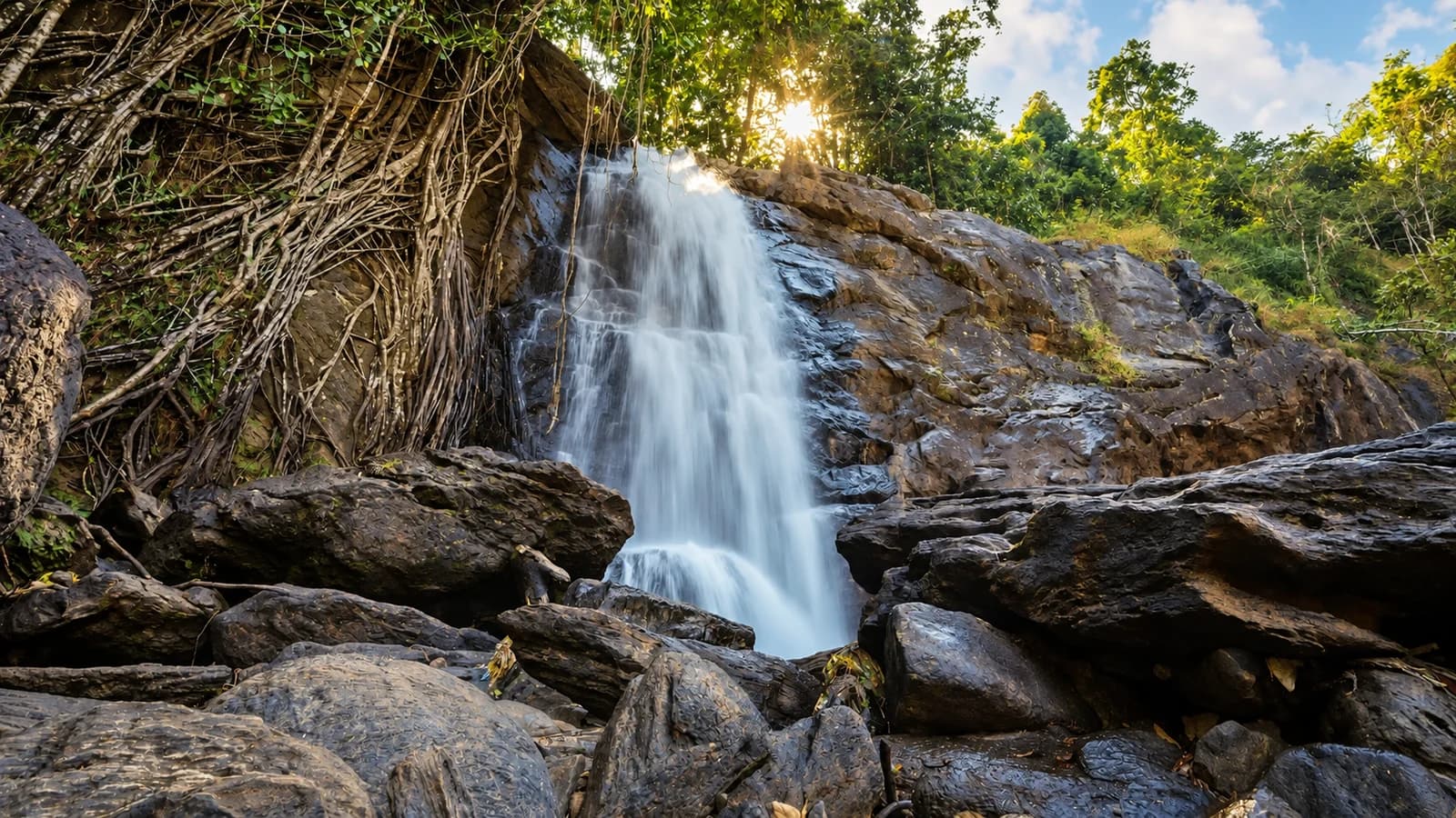 Soochipara waterfall among rocks and forest