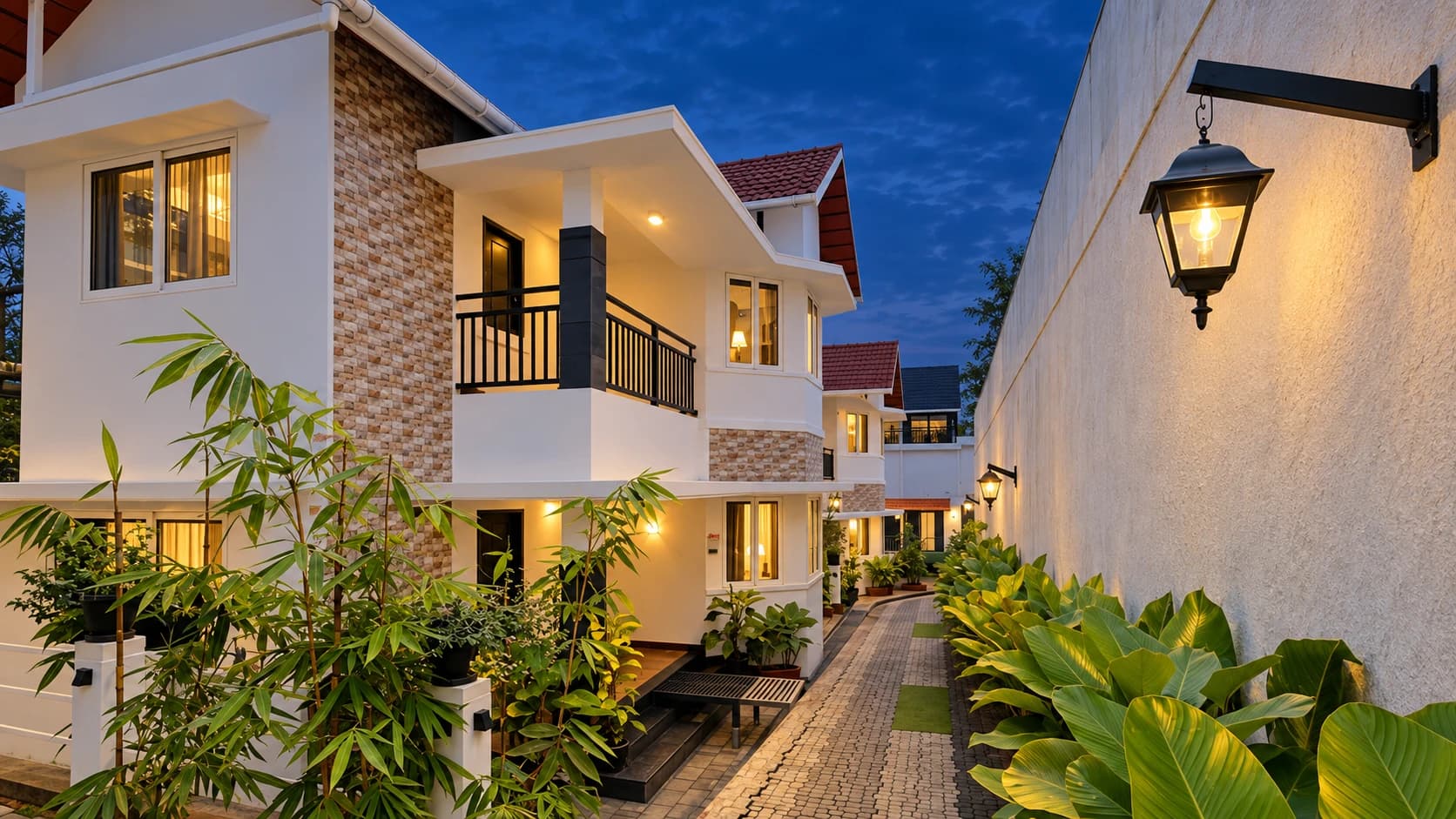 White villas and planted walkway at Golden Oak Resorts